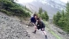 Headbanging while hiking down a mountain